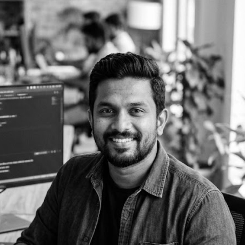 Tishan David, a Sydney-based software developer, in a black-and-white portrait.